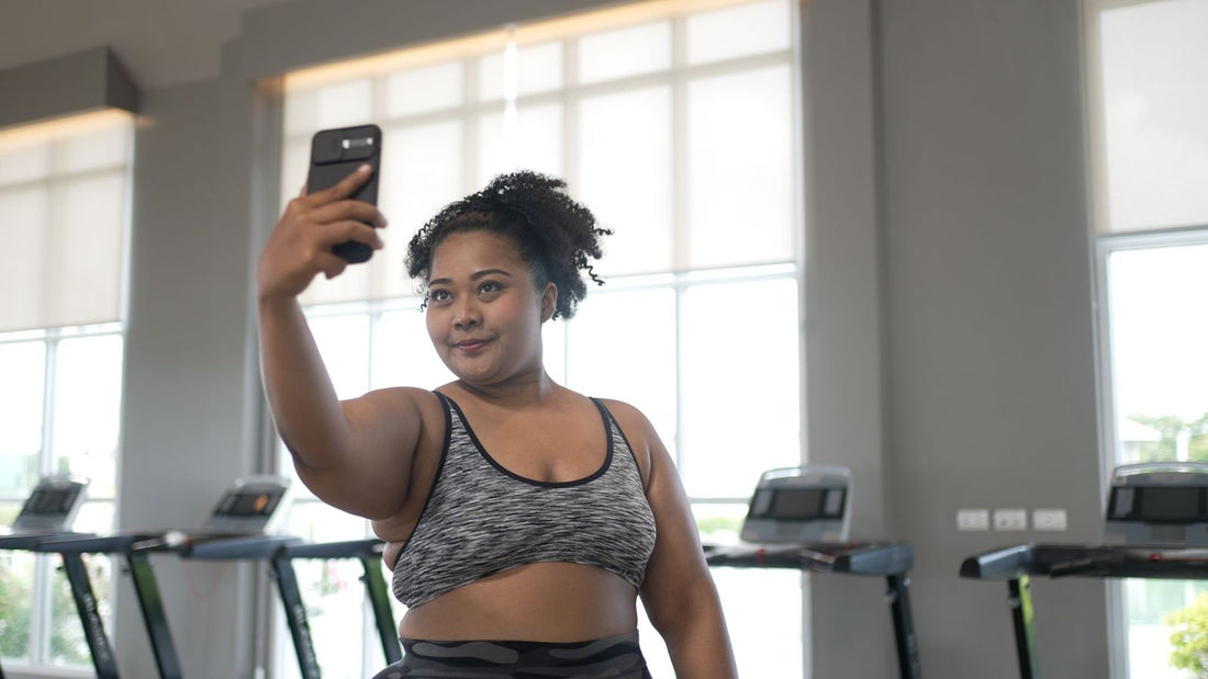 A girl takes a selfie in the gym